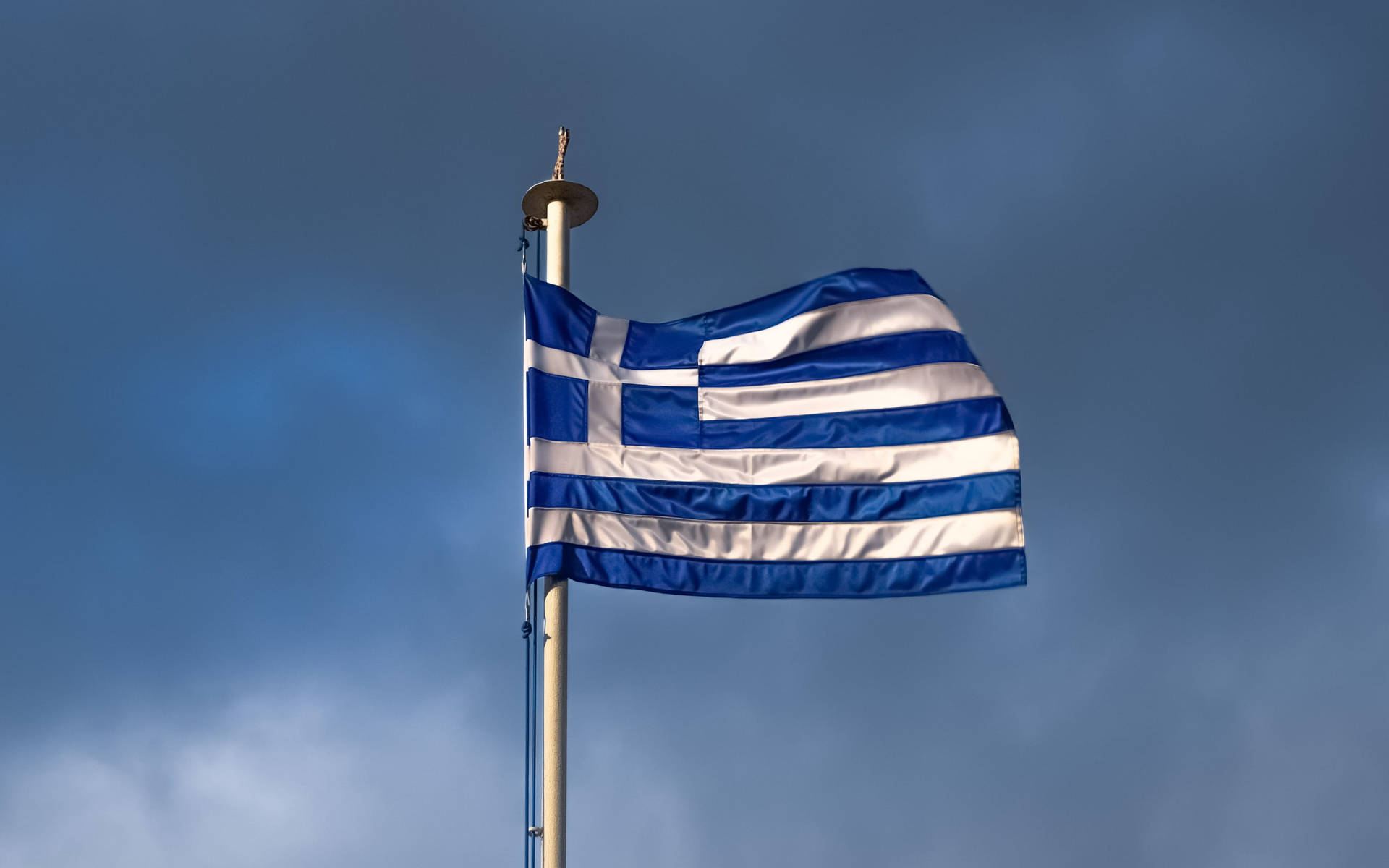 Greek Flag Gloomy Skies Background