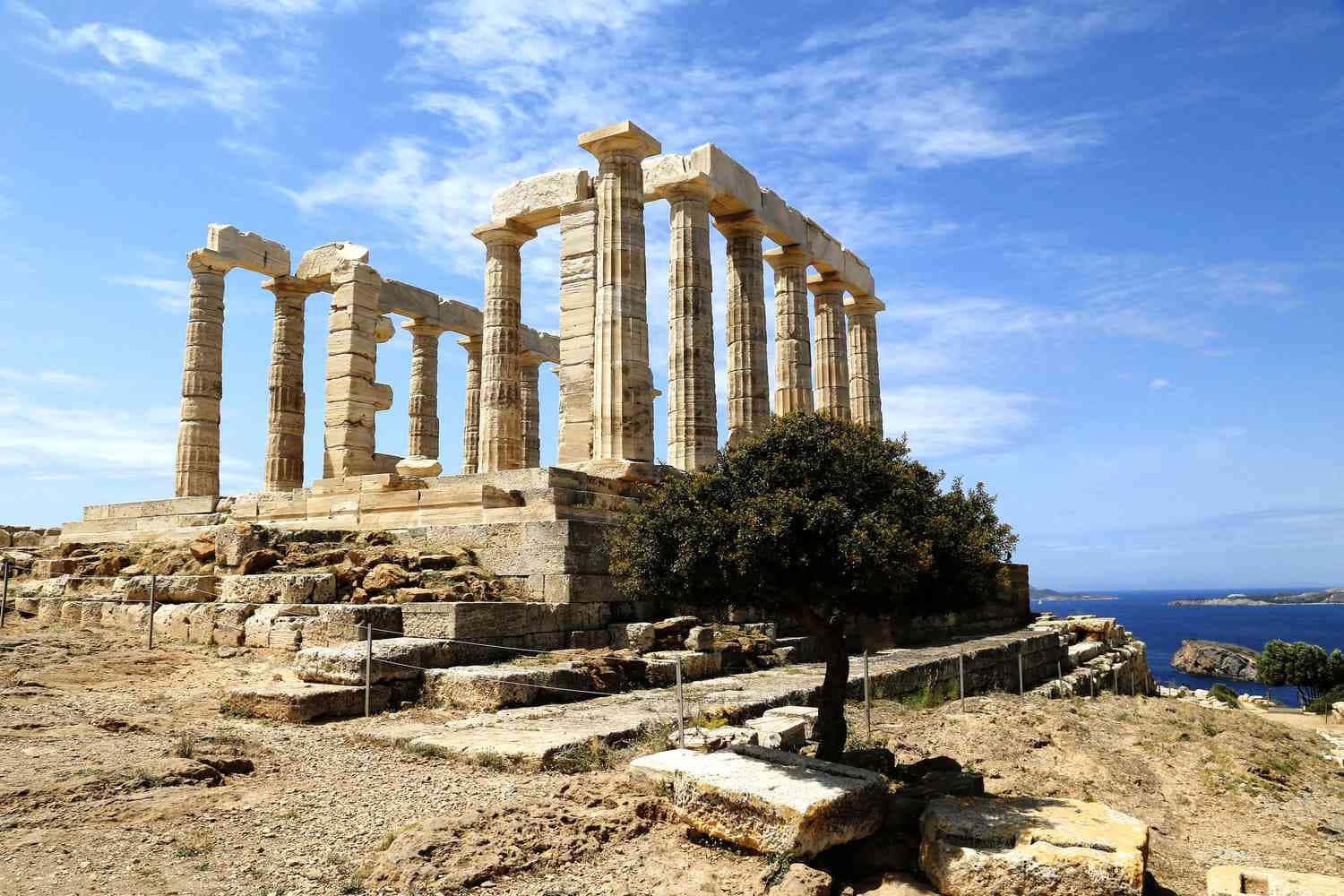 Greek Temple Ruins In Sounion Background