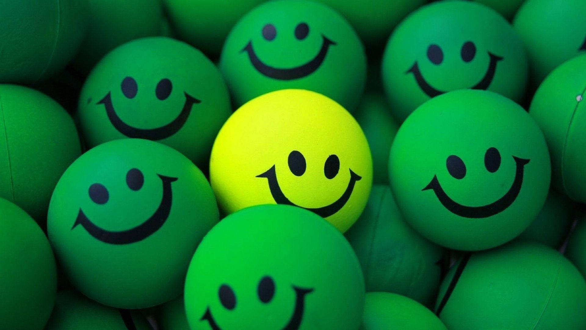 Green And Yellow Happy Stress Balls Background