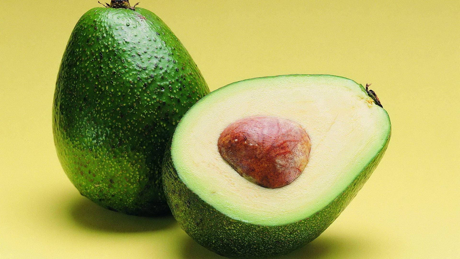 Green Avocado Fruit In Halves Still Shot Background