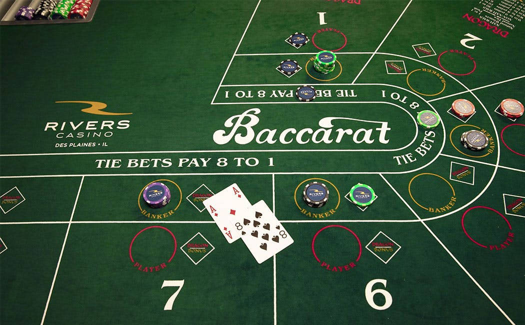 Green Baccarat Table With Cards And Chips Background