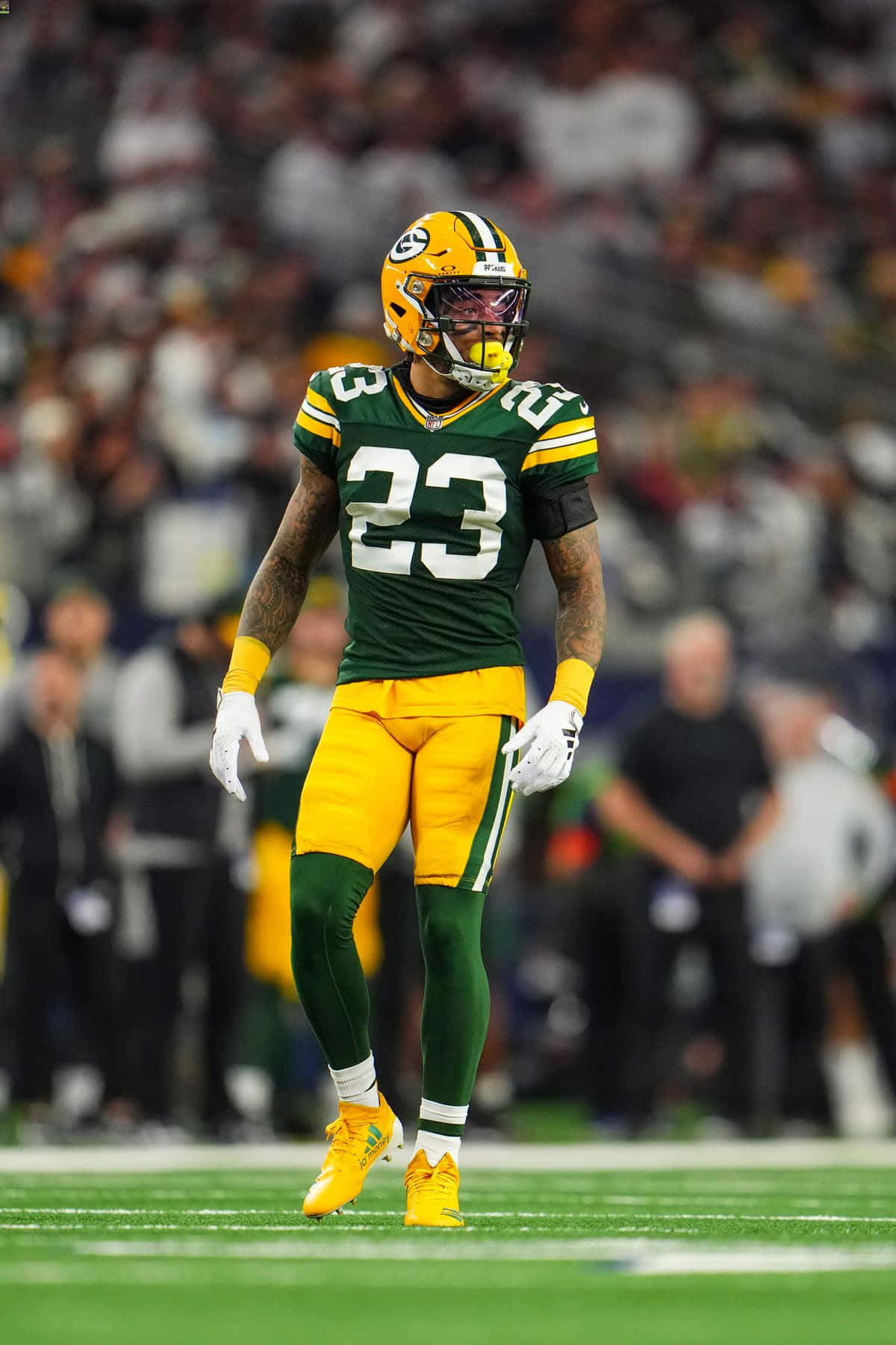Green Bay Packers Player23 Standingon Field Background