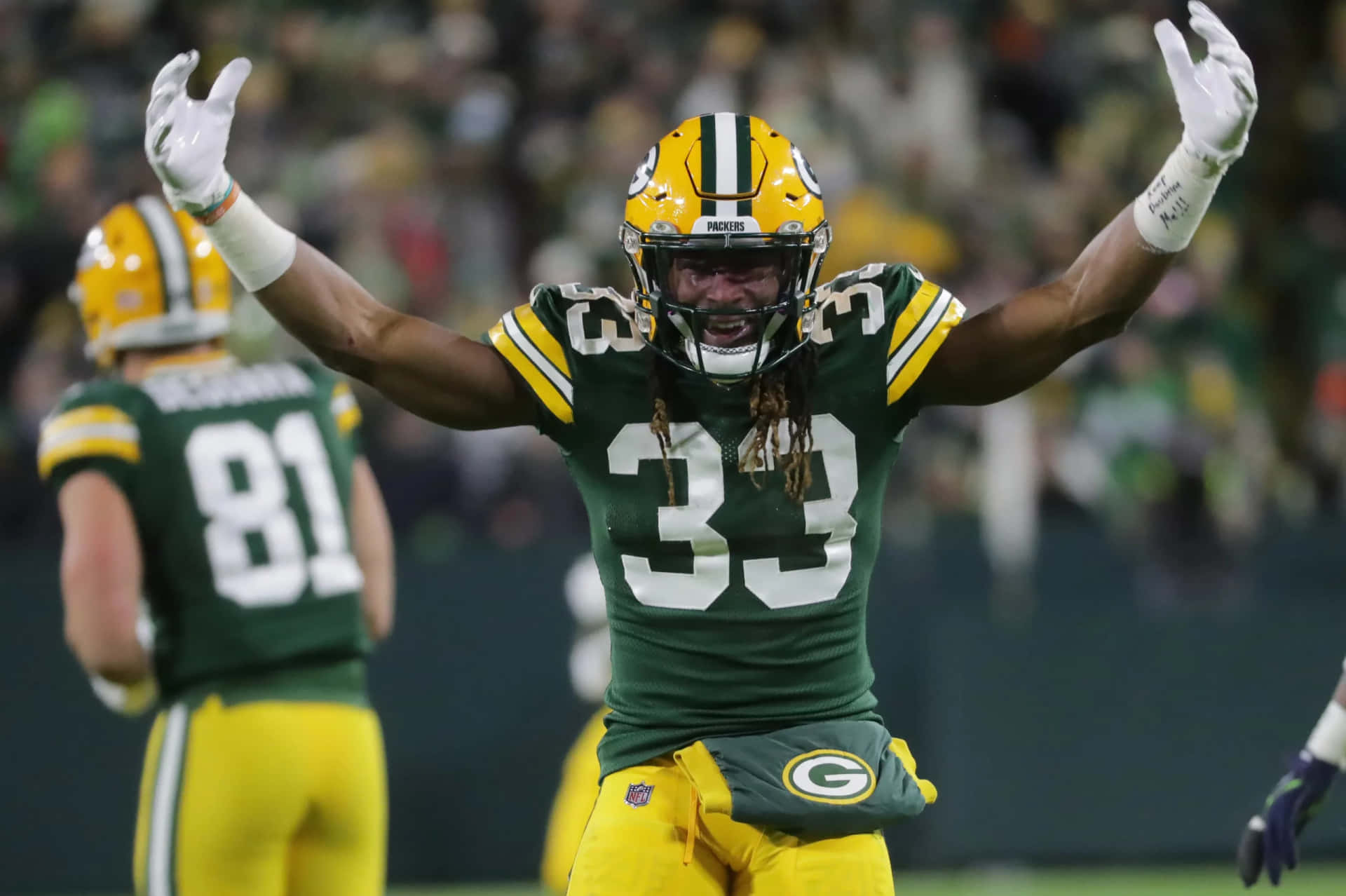 Green Bay Packers Running Back Aaron Jones Celebrates A Touchdown