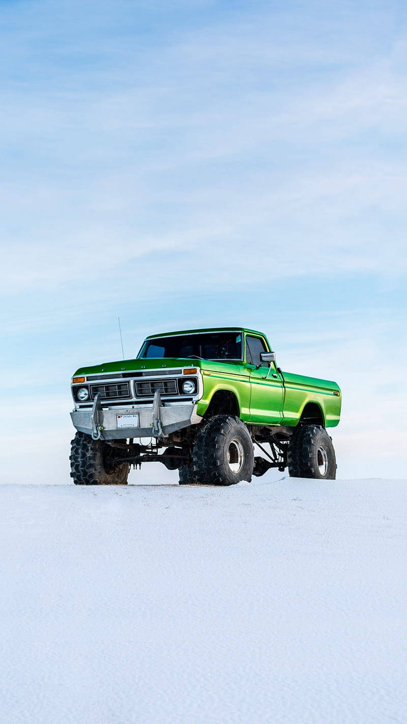 Green Cool Truck In Snow Background