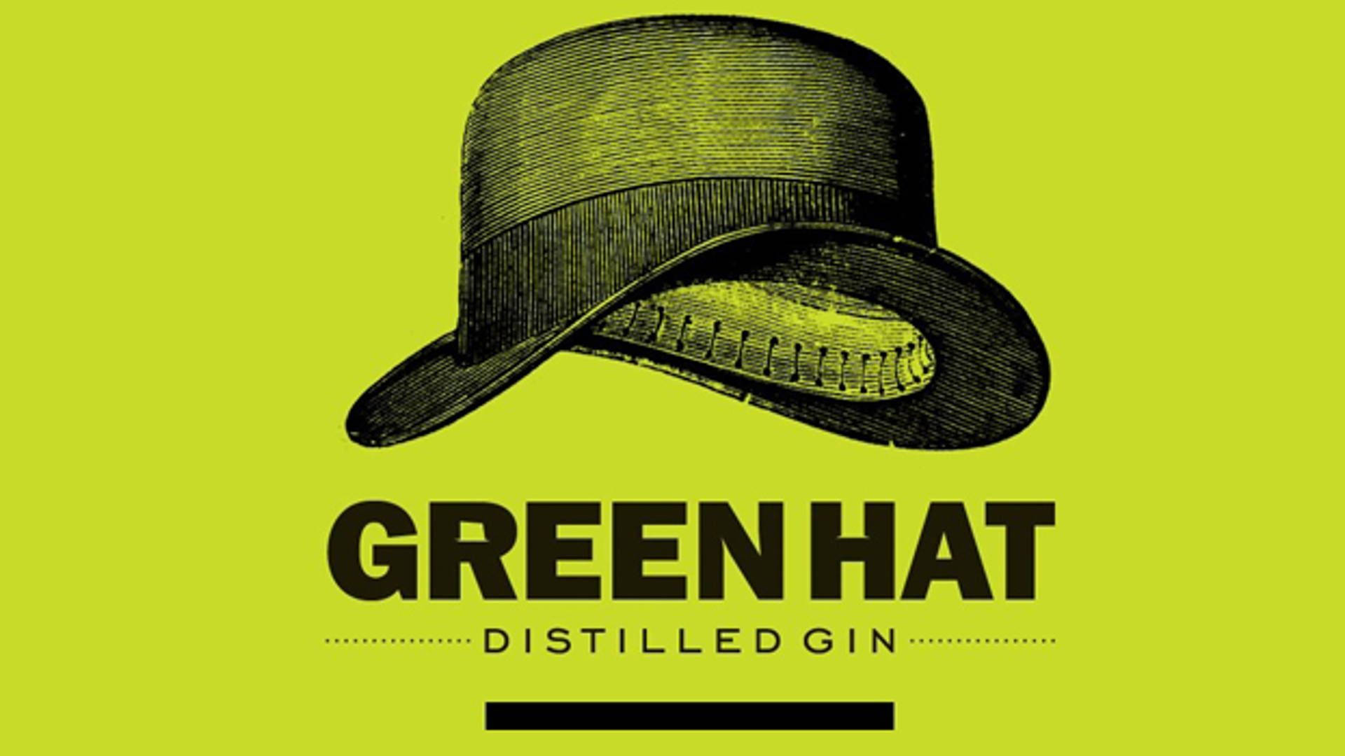 Green Hat Distilled Gin Logo On Wooden Background