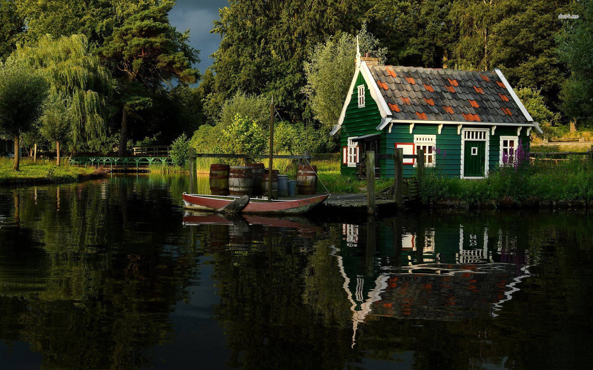 Green House Along The Riverside Background