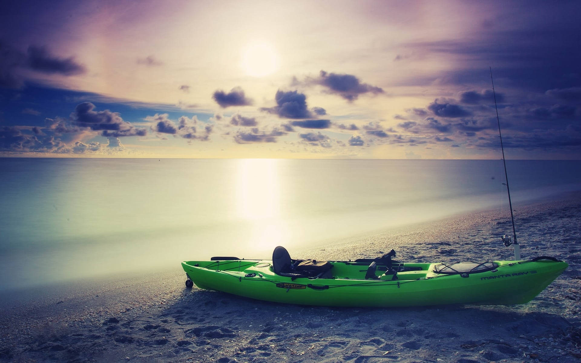 Green Kayak On A Beach Background