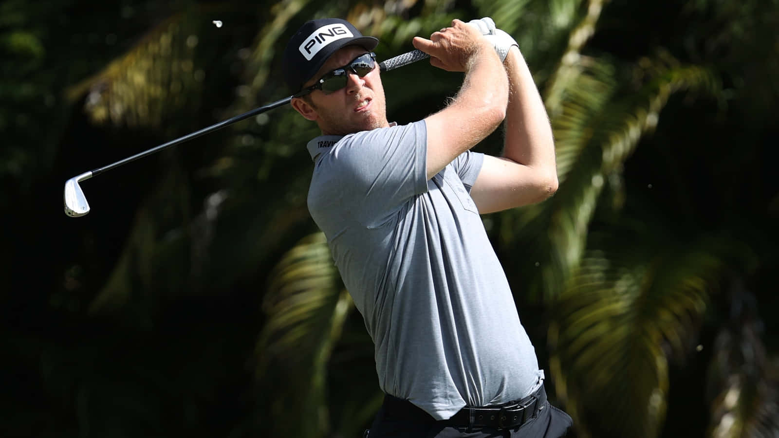 Greg Chalmers Swinging Golf Club Background