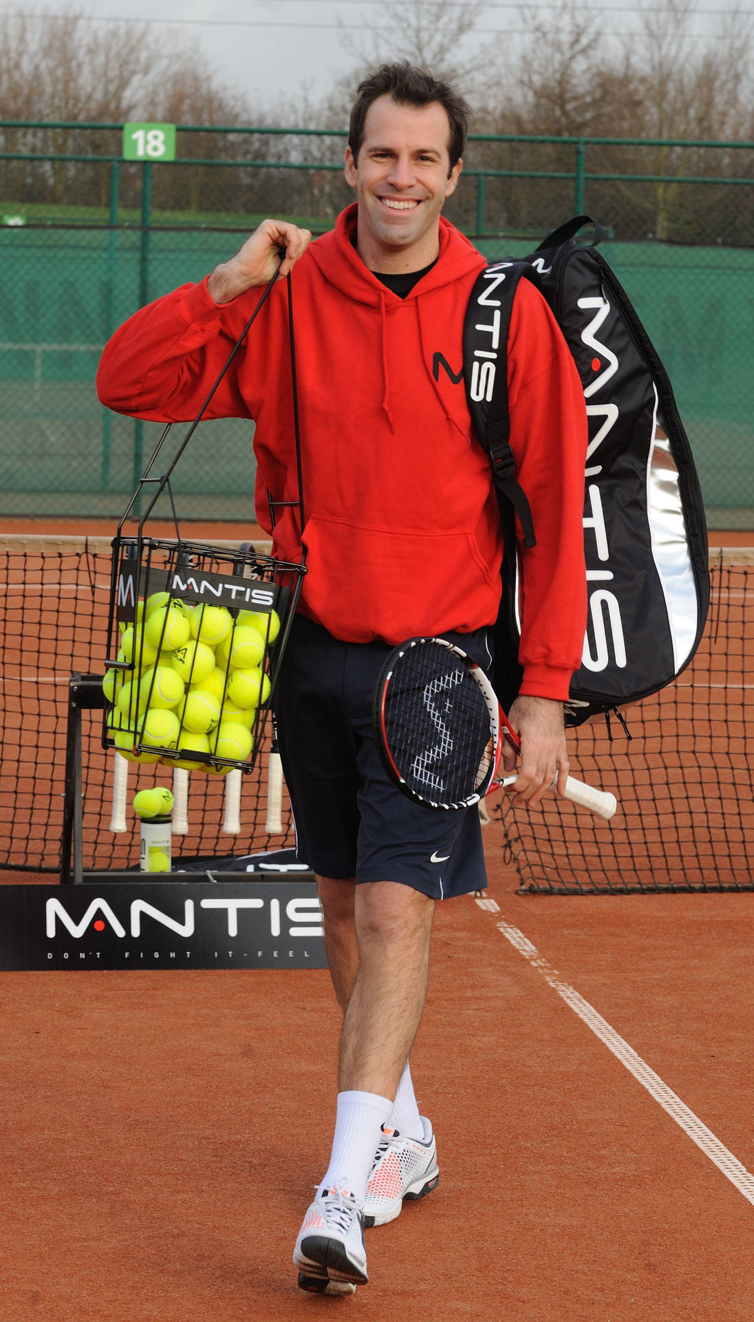 Greg Rusedski Carrying Gear Background