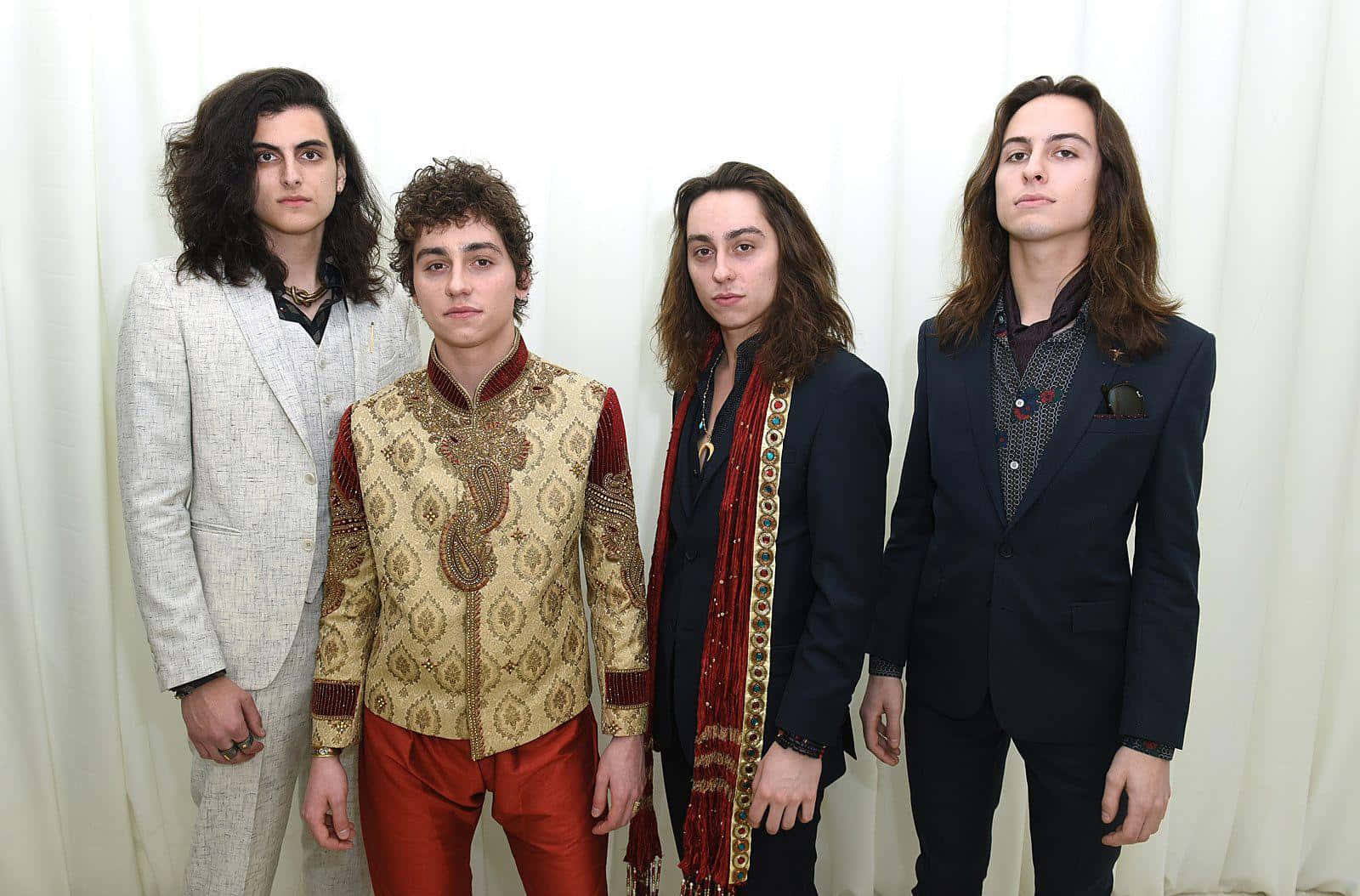 Greta Van Fleet Members Wearing Formal Suits Picture Background