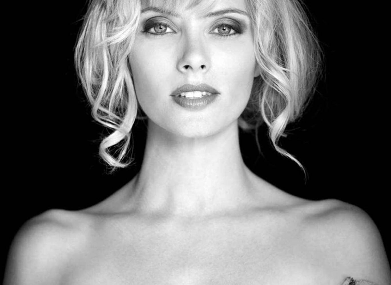 Greyscale Photo Of April Bowlby Background