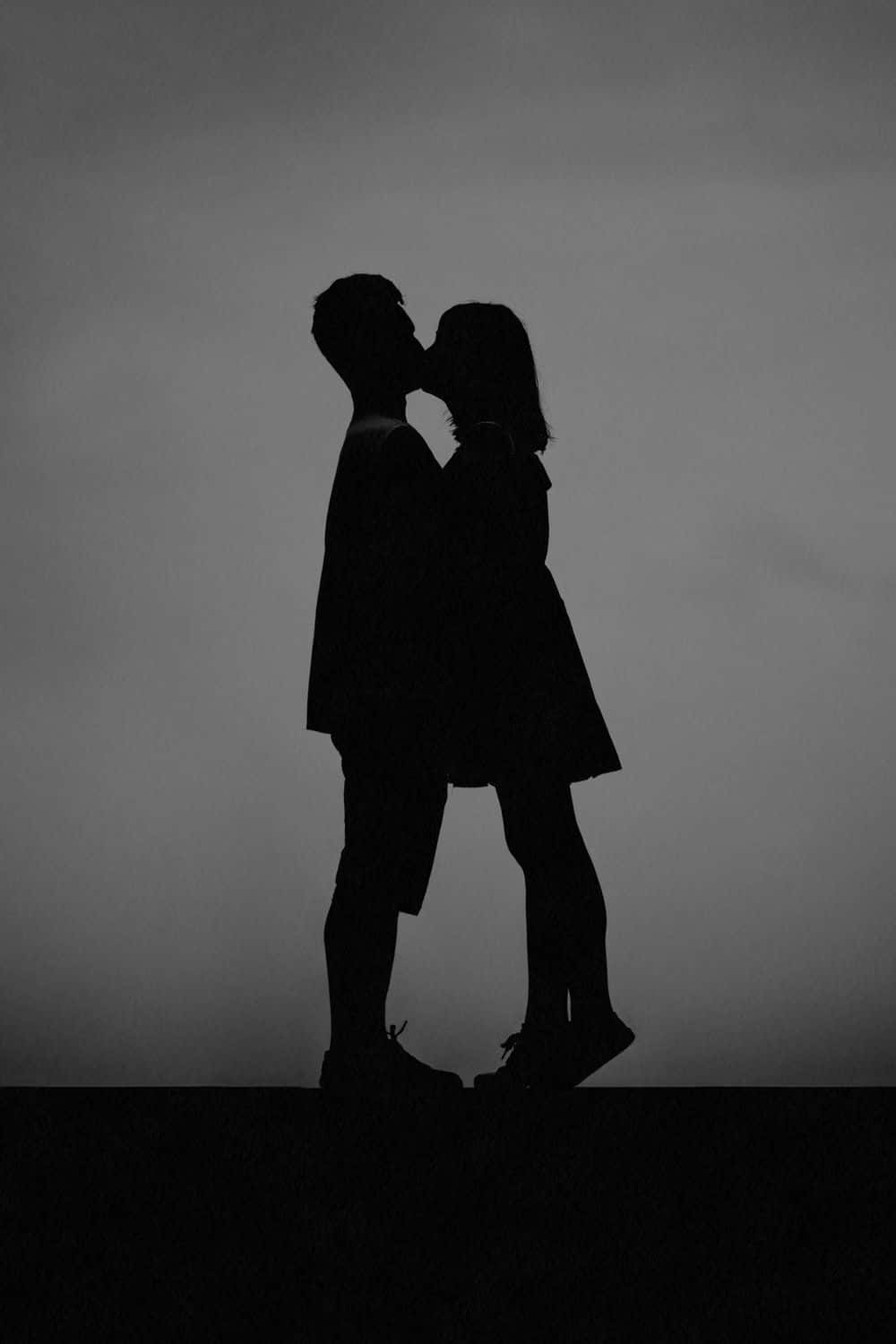 Greyscale Photo Of Kissing Lips