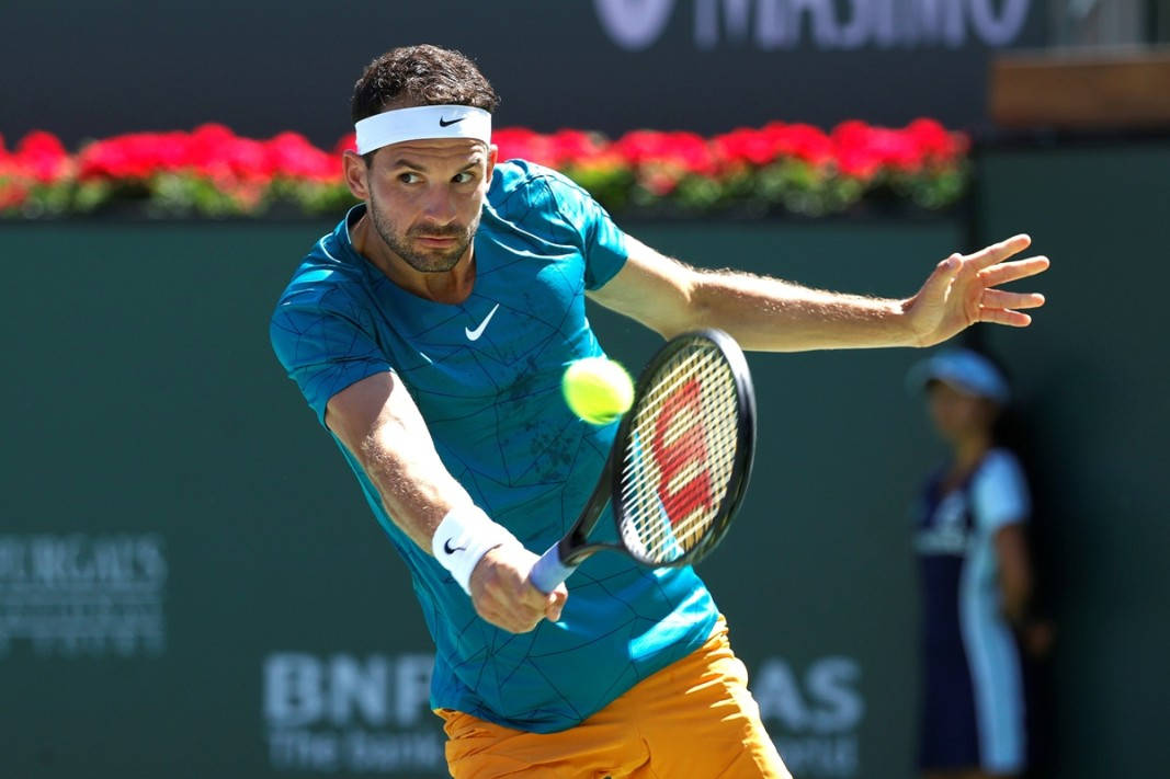 Grigor Dimitrov Hitting Tennis Ball Background