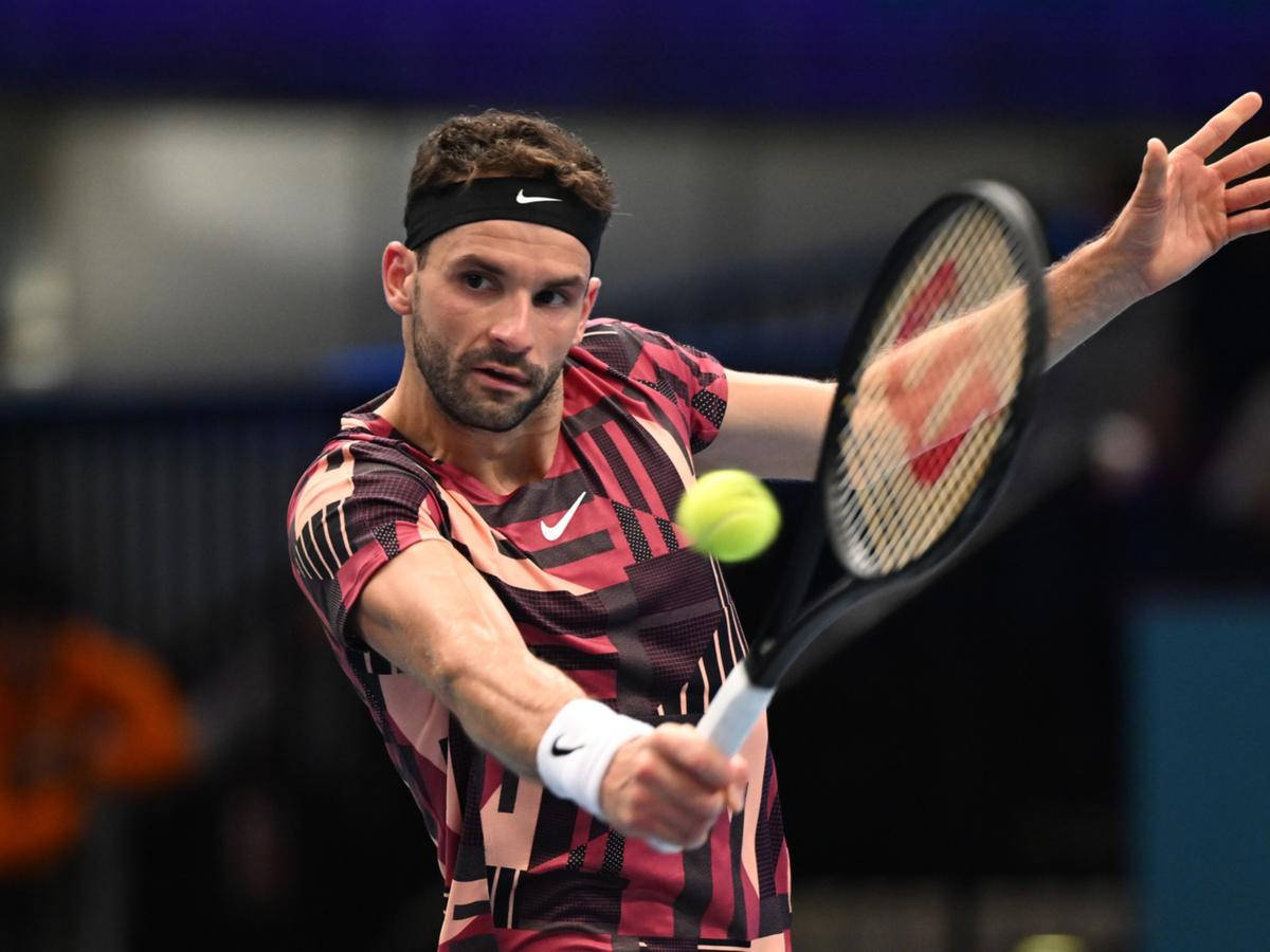 Grigor Dimitrov In Action On The Tennis Court