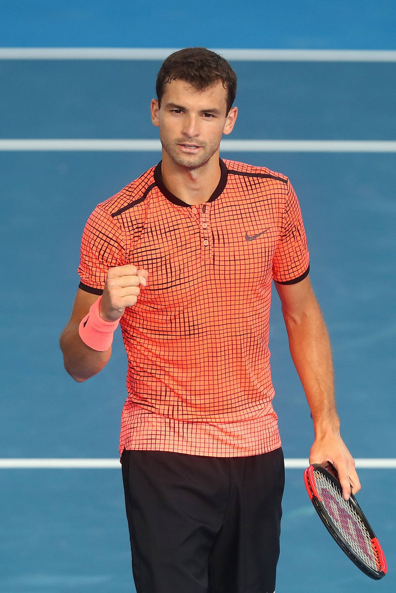 Grigor Dimitrov In Eye-catching Orange Shirt Background