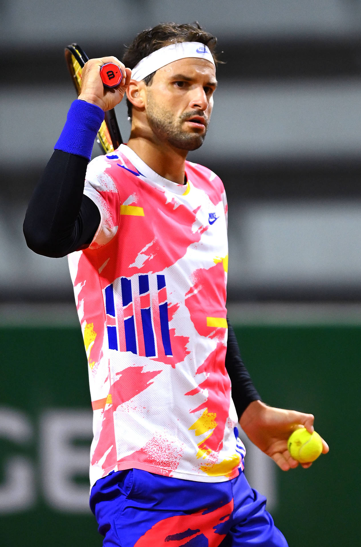 Grigor Dimitrov Wearing Neon Pink Colors Background