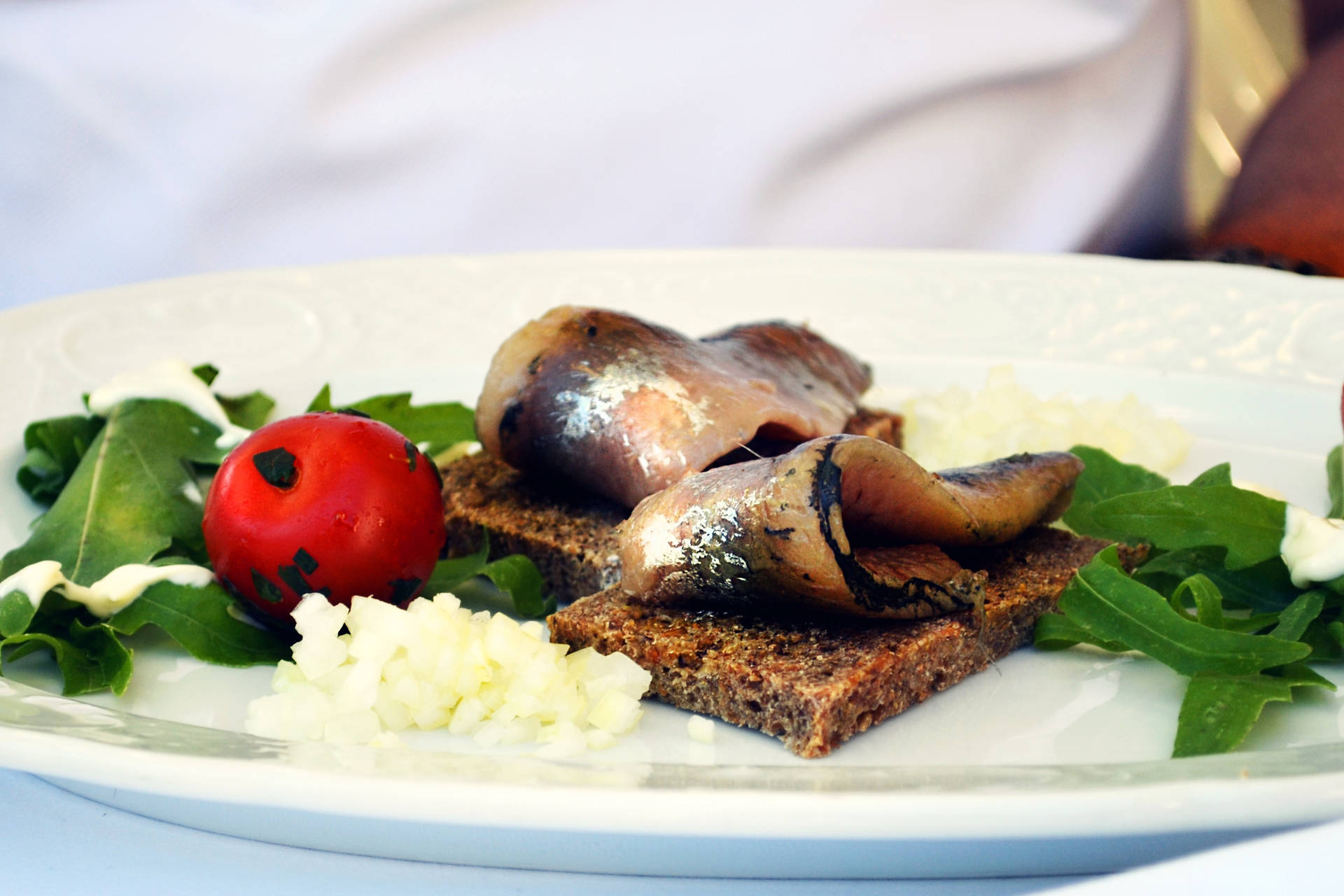 Grilled Boneless Herrings On A Plate Background