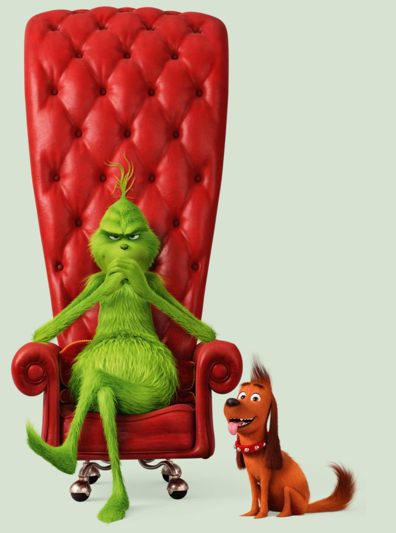 Grinch On A Red Couch Background