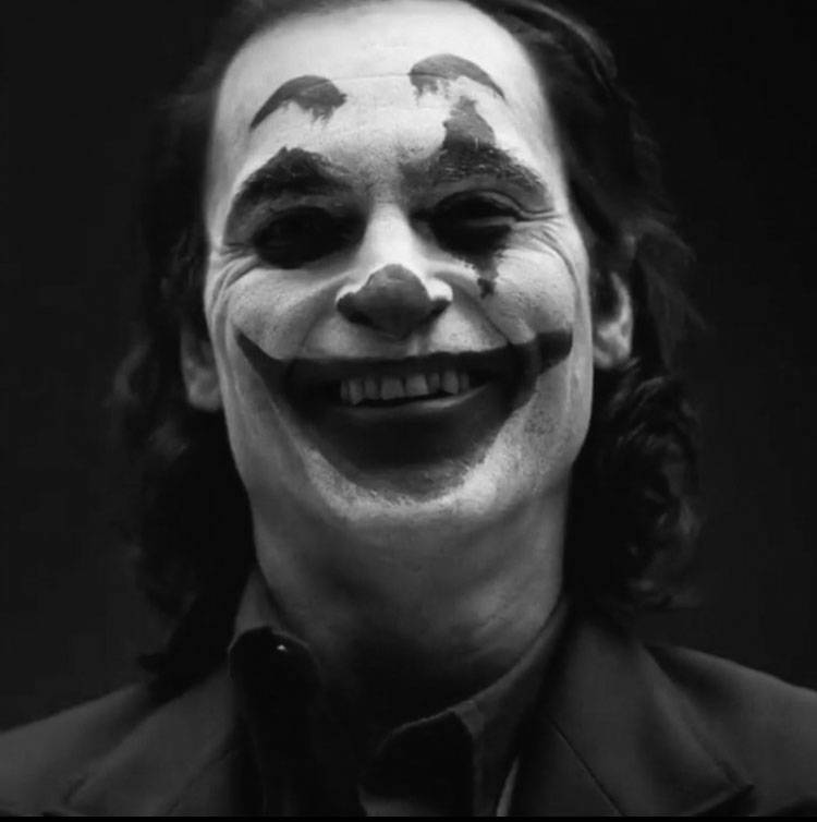 Grinning Black And White Joker Background