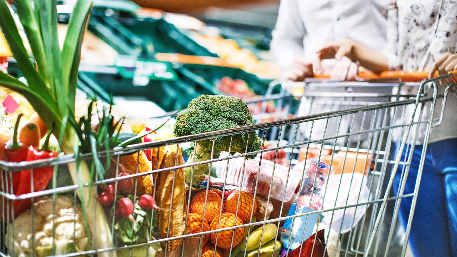 Grocery Items Metallic Shopping Cart Background