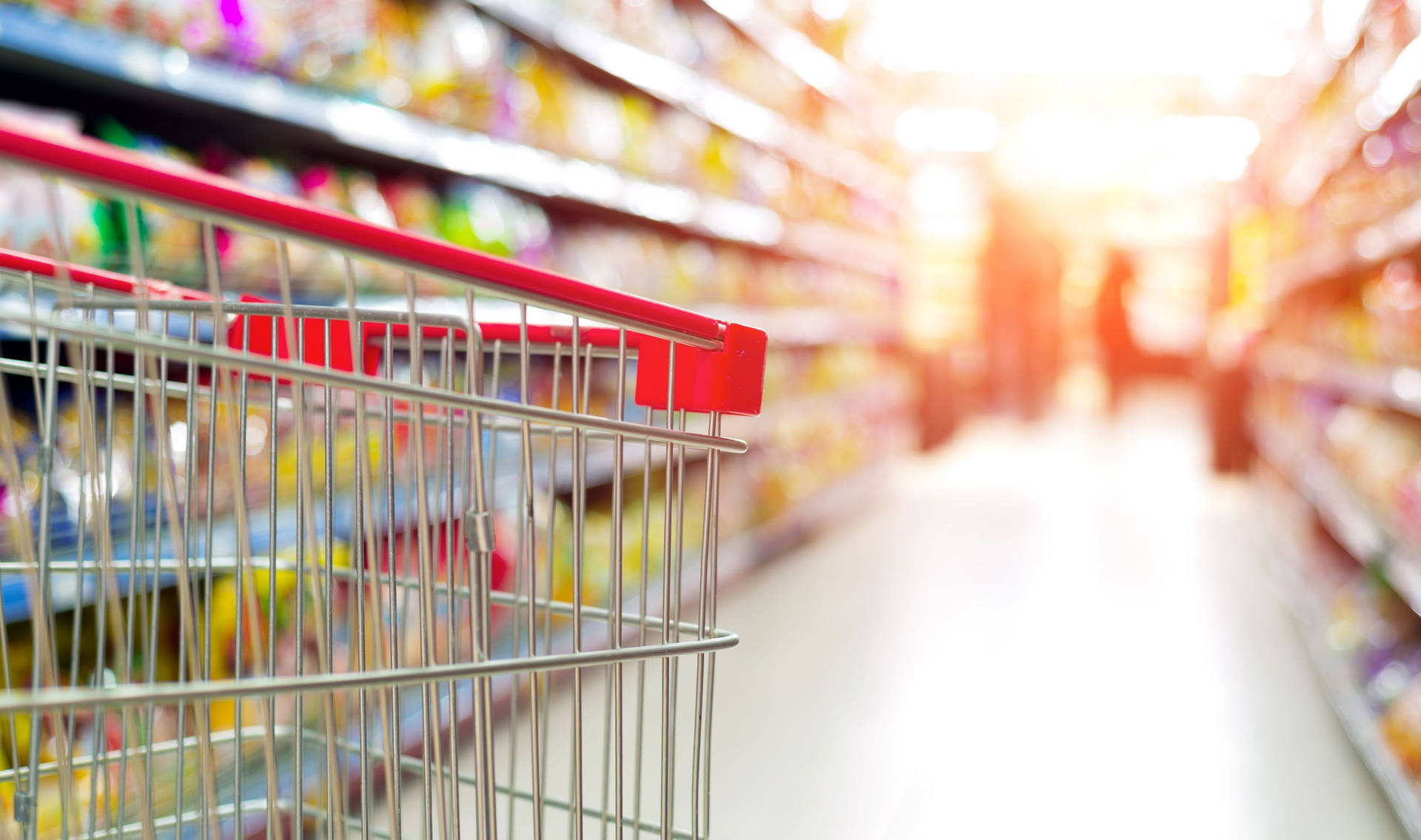 Grocery Shopping Cart In Supermarket Background