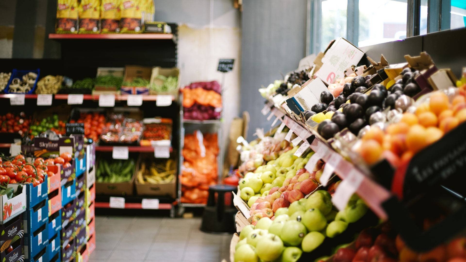 Grocery Store Variety Of Fruits Background