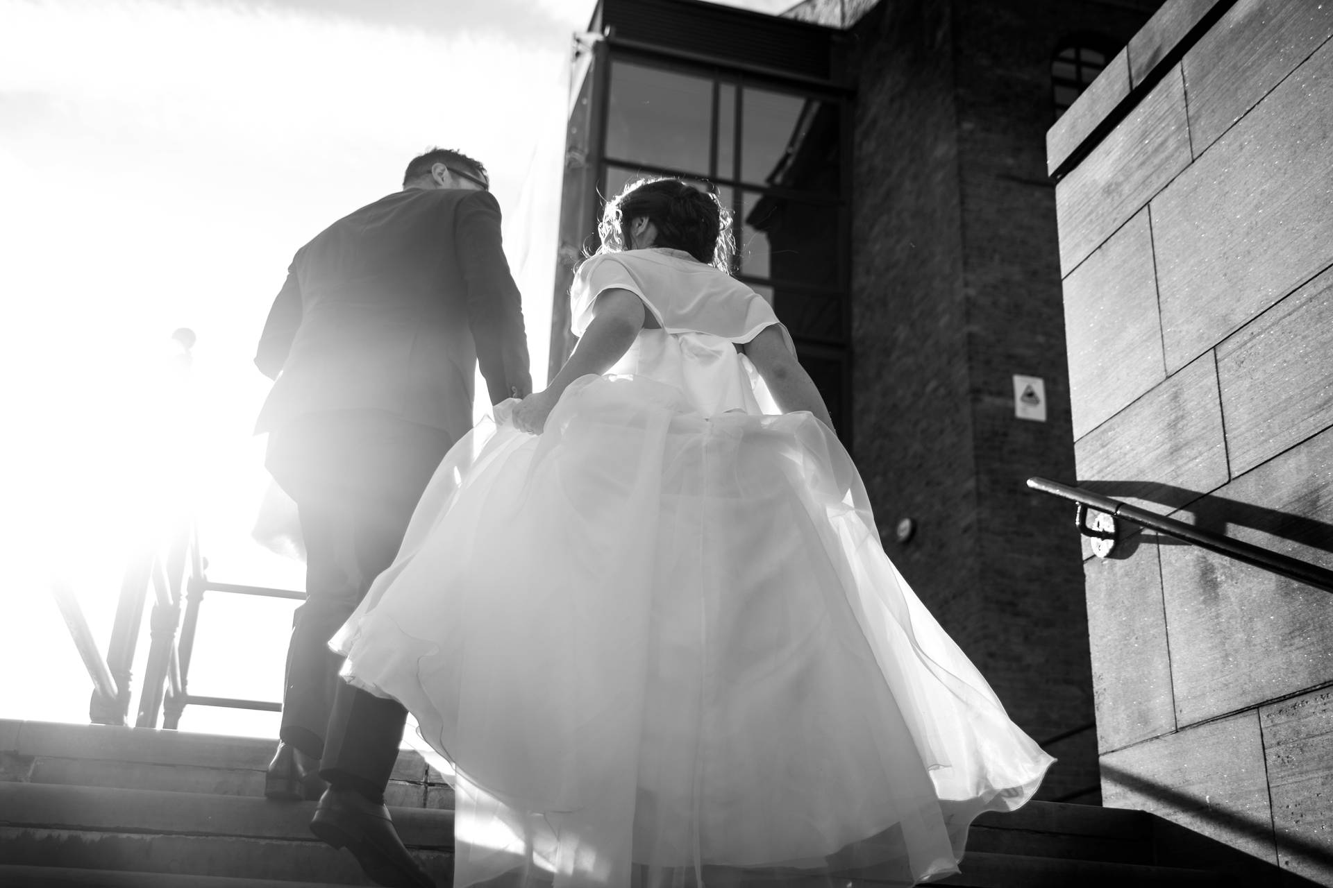 Groom And Bride On Staircase Background