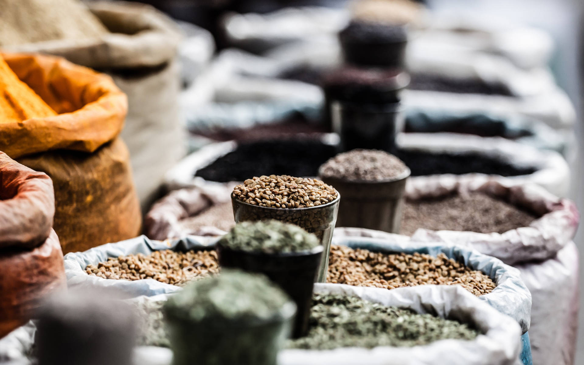 Ground Spices In Sacks Focused Shot Background