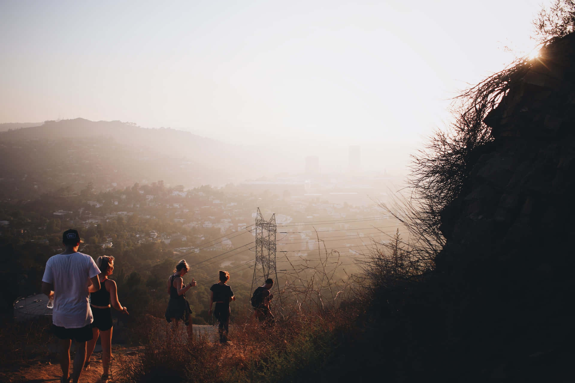 Group Of Friends Going Down The Mountain Slope