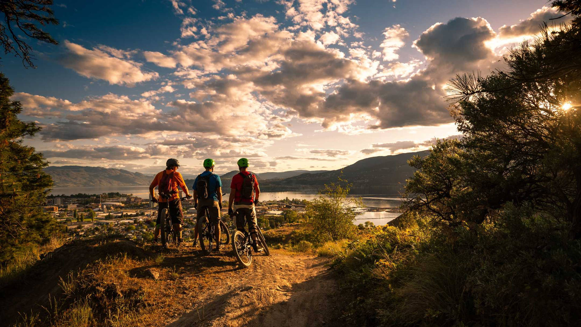 Group Of Friends Mountain Biking Knox Mountain Park Background