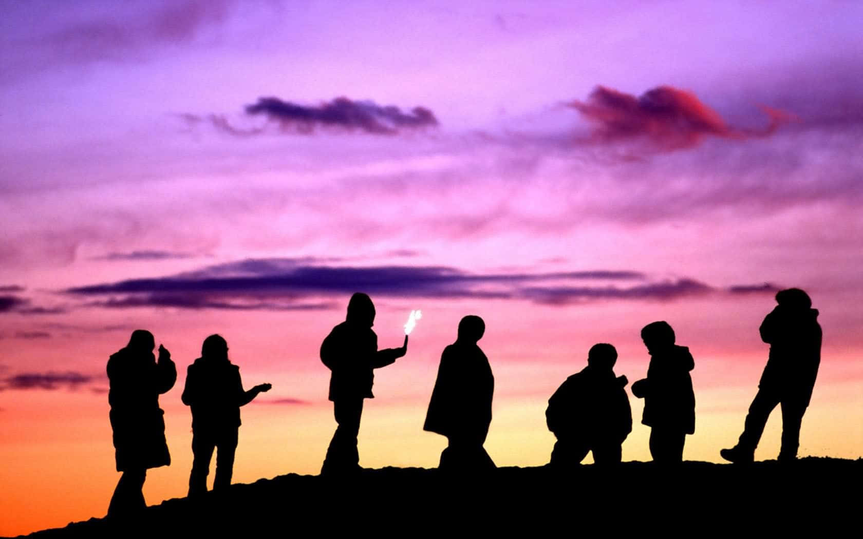 Group Of Friends With Colorful Skies