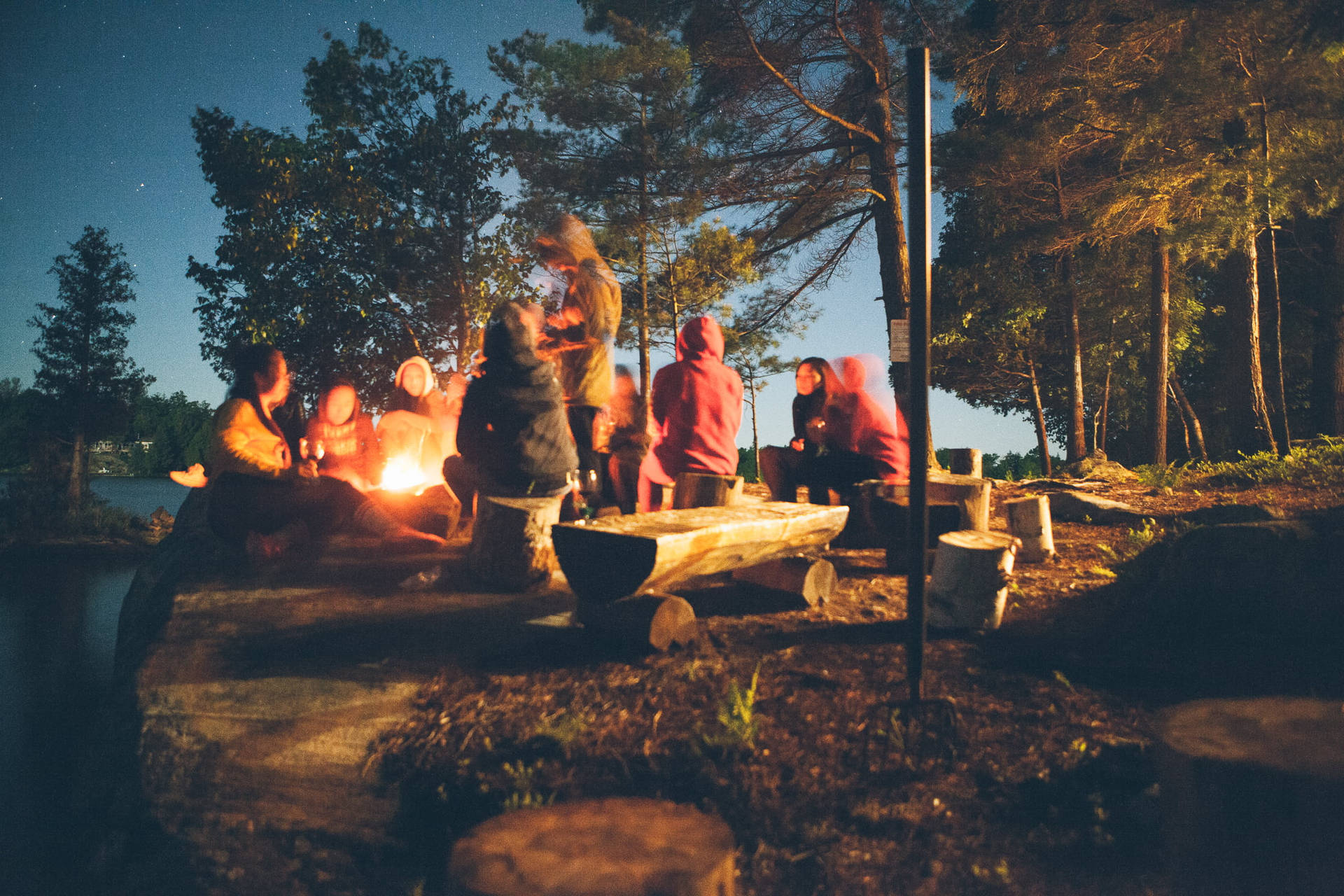 Group Of People Camping Together Background