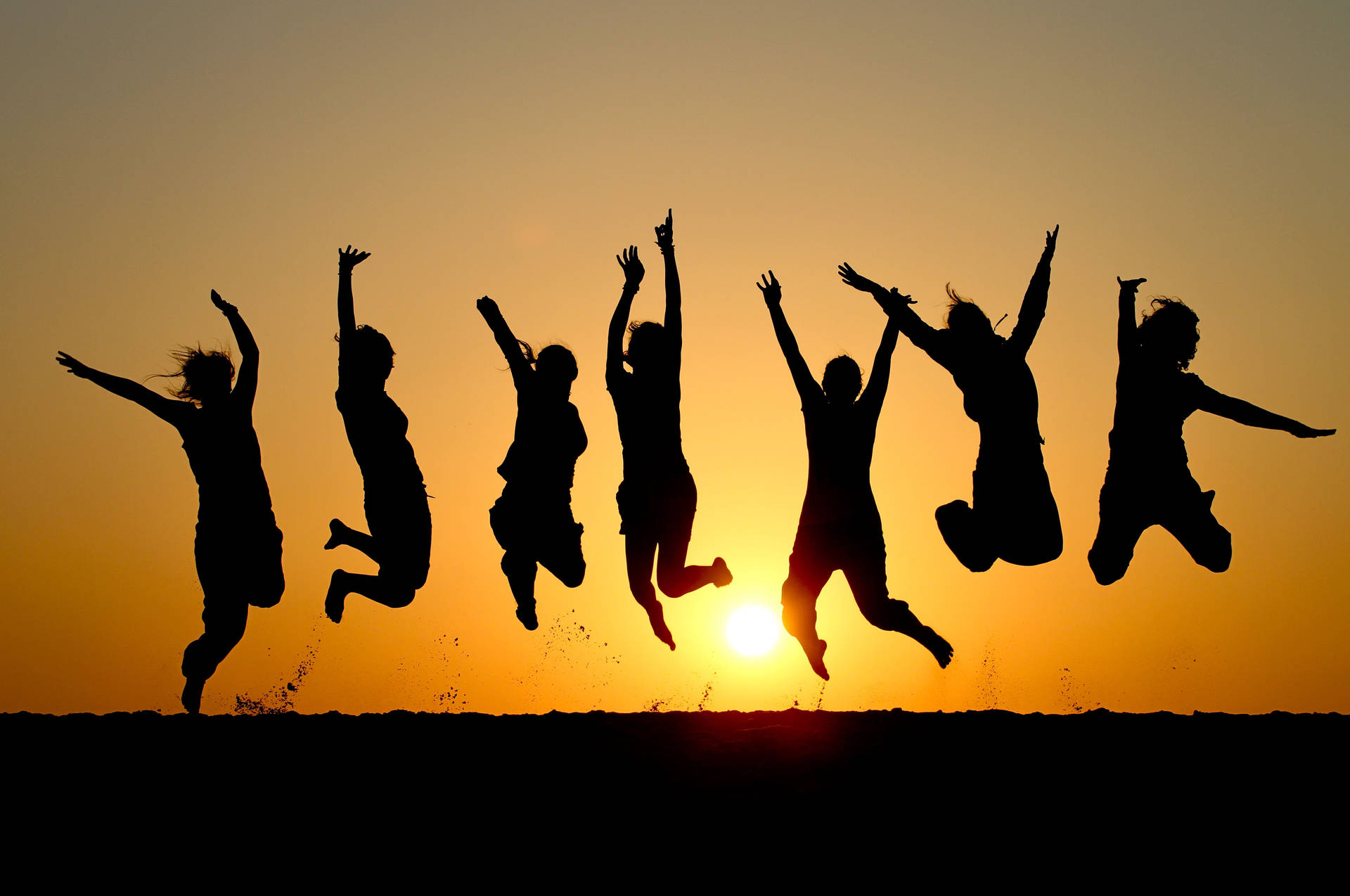 Group Of People Jumping In The Air