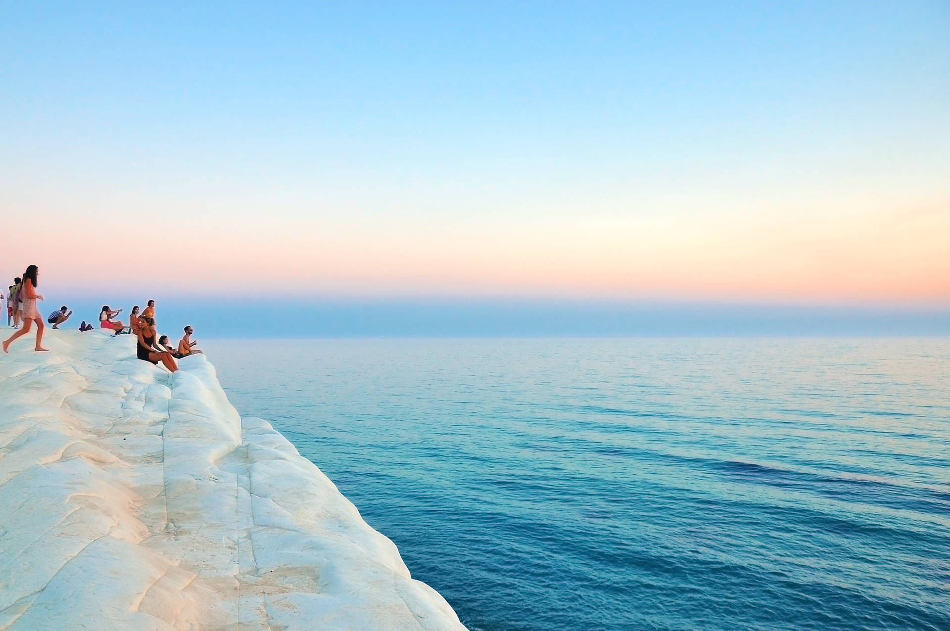 Group Of People On Scala Dei Turchi Background