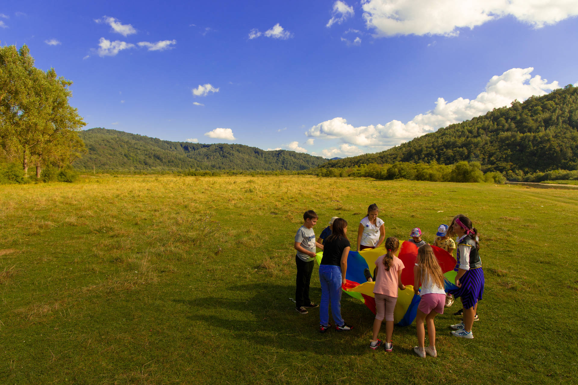 Group Of People Playing Outdoors Background