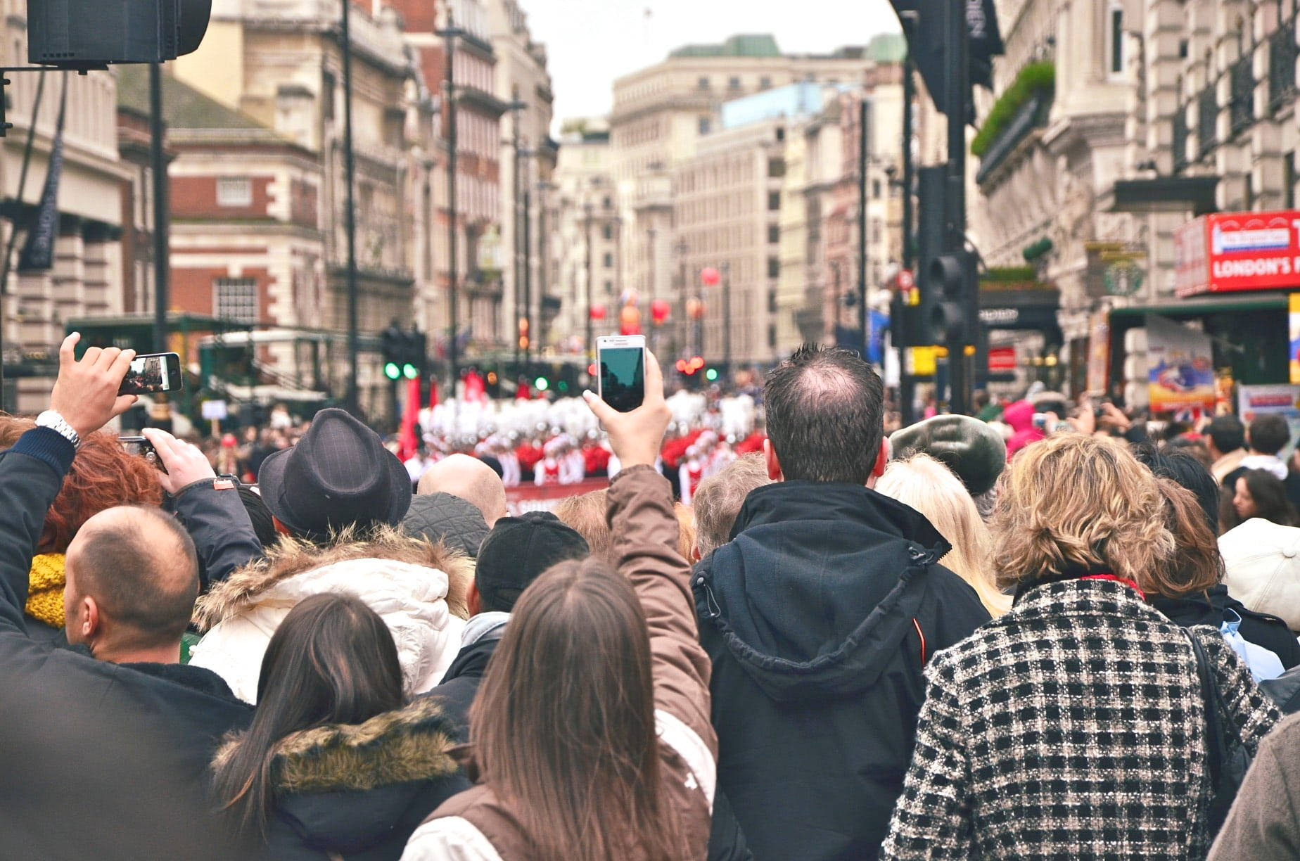 Group Of People Watching A Parade Background