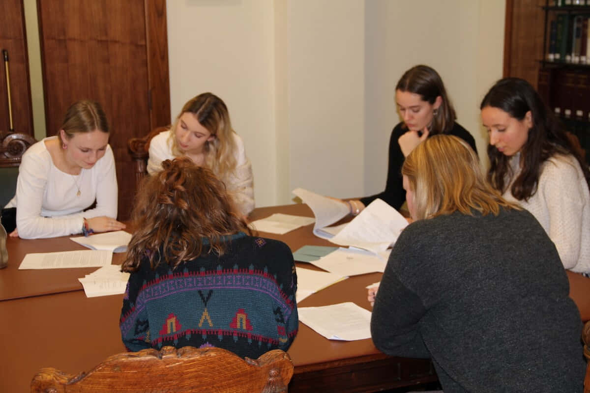 Group Study Session At Table Background