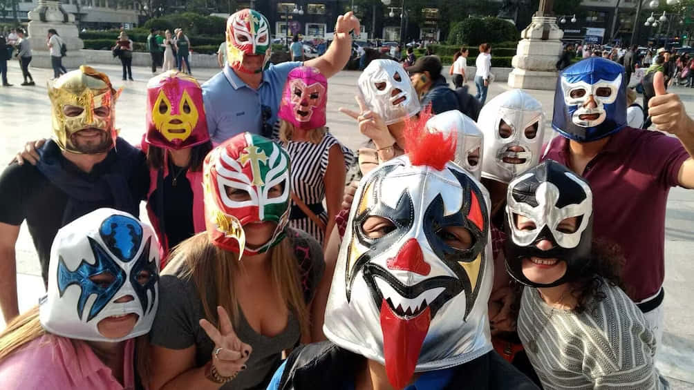 Groupof Friends Wearing Lucha Libre Masks Background