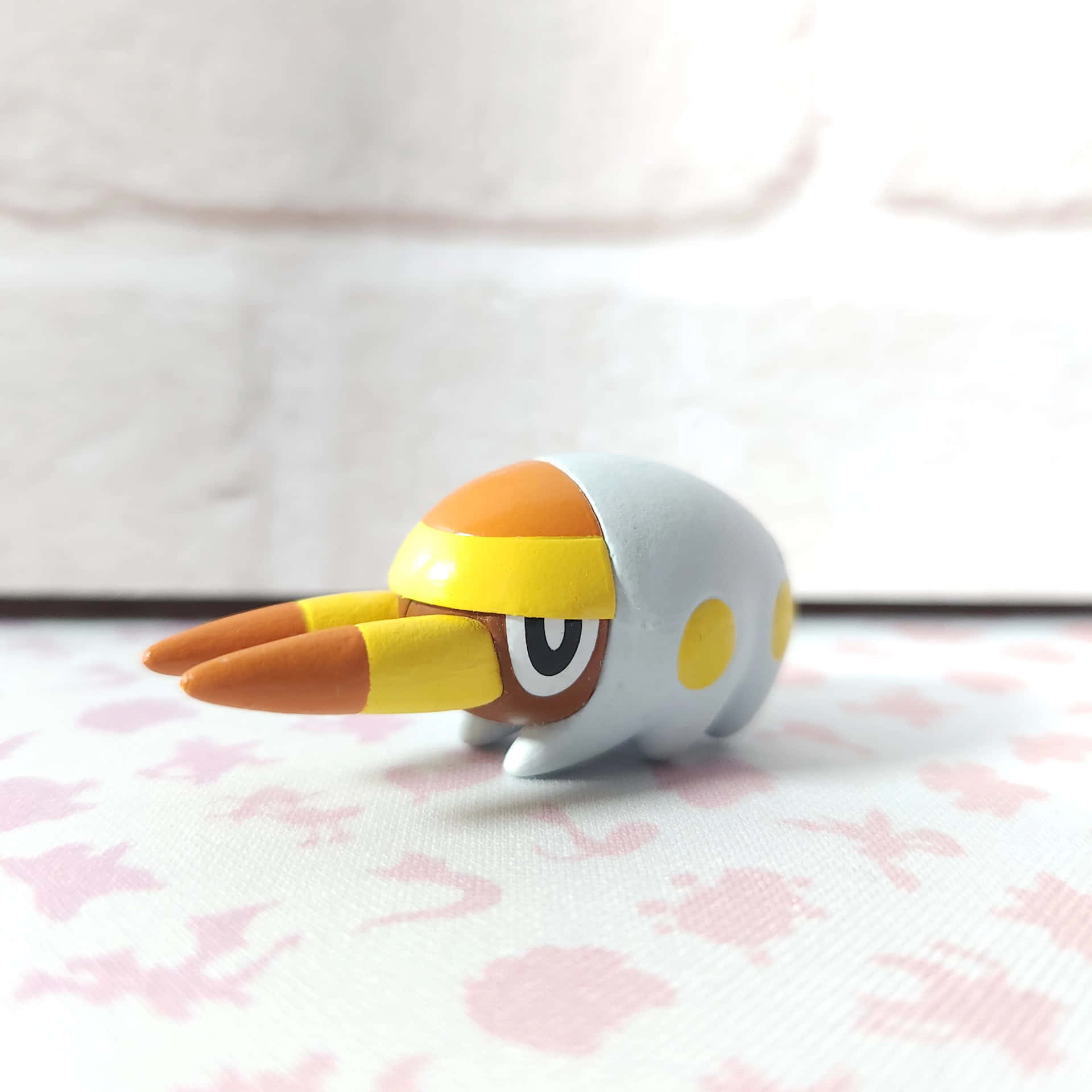 Grubbin Pokemon Figureon Floral Background Background