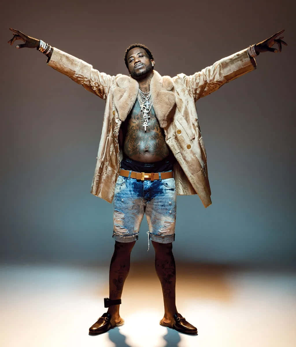 Gucci Mane_ Fur Coat_ Pose Background