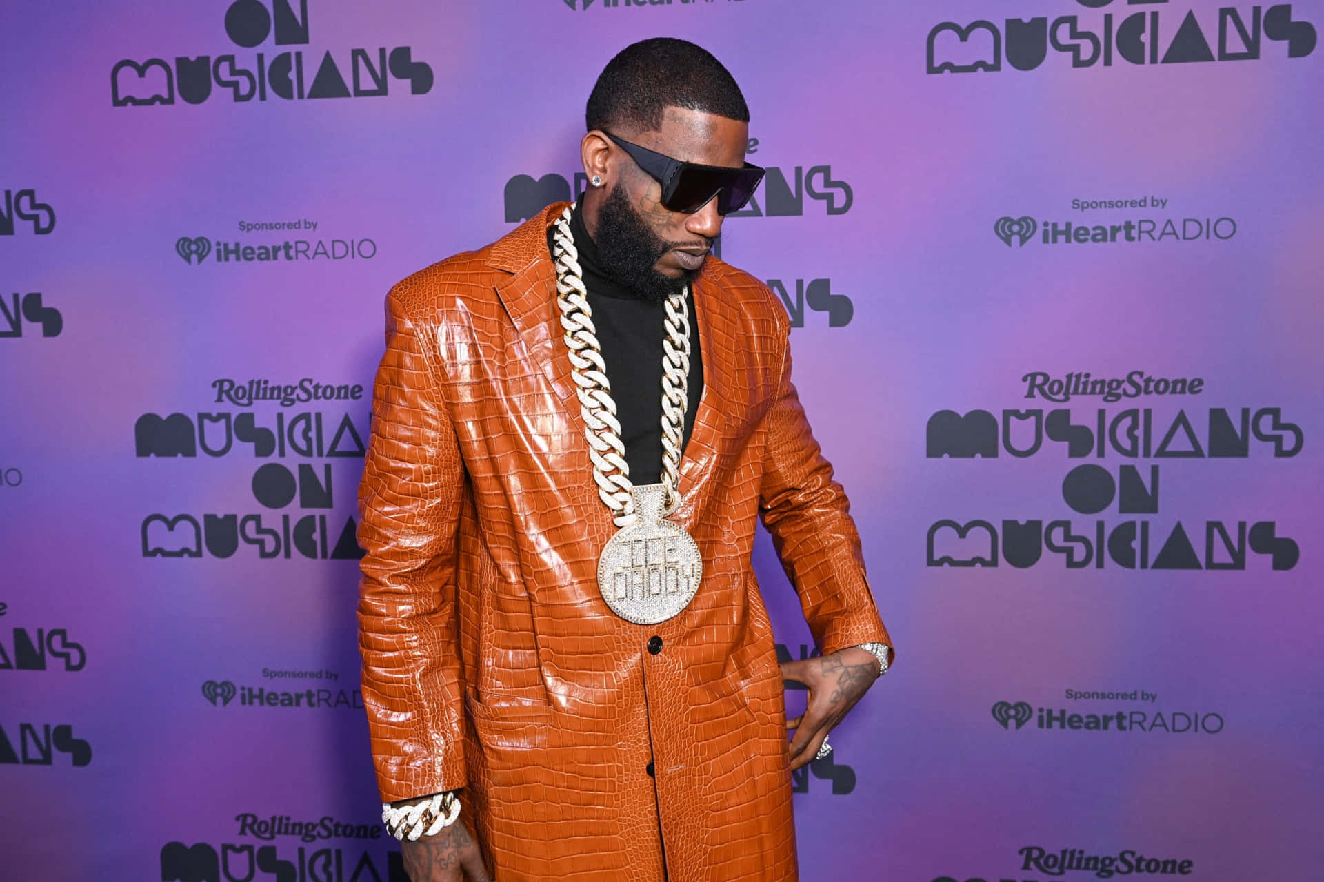 Gucci Mane Orange Suit Event Background