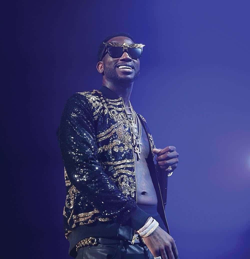 Gucci Mane Performingon Stage Background