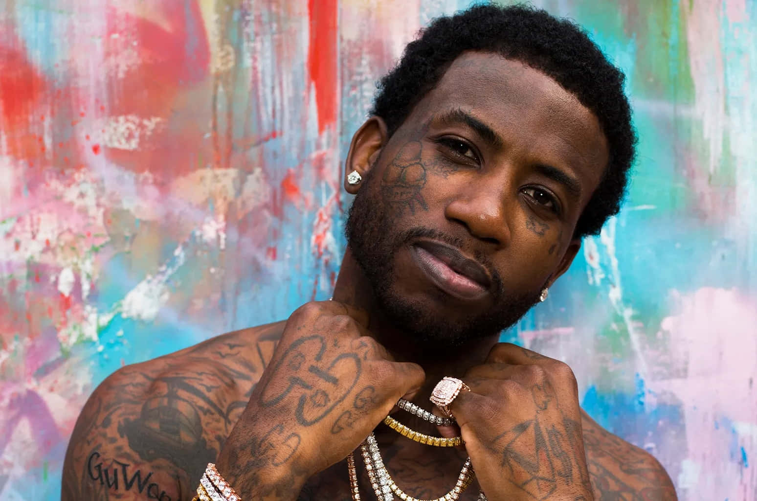 Gucci Mane Portrait Against Colorful Backdrop Background