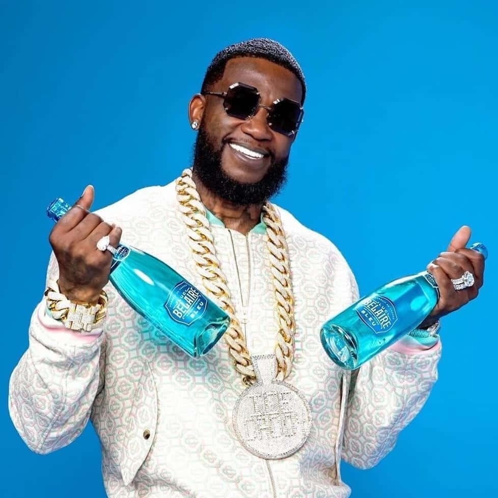 Gucci Mane Promoting Bel Air Blue Bottles Background