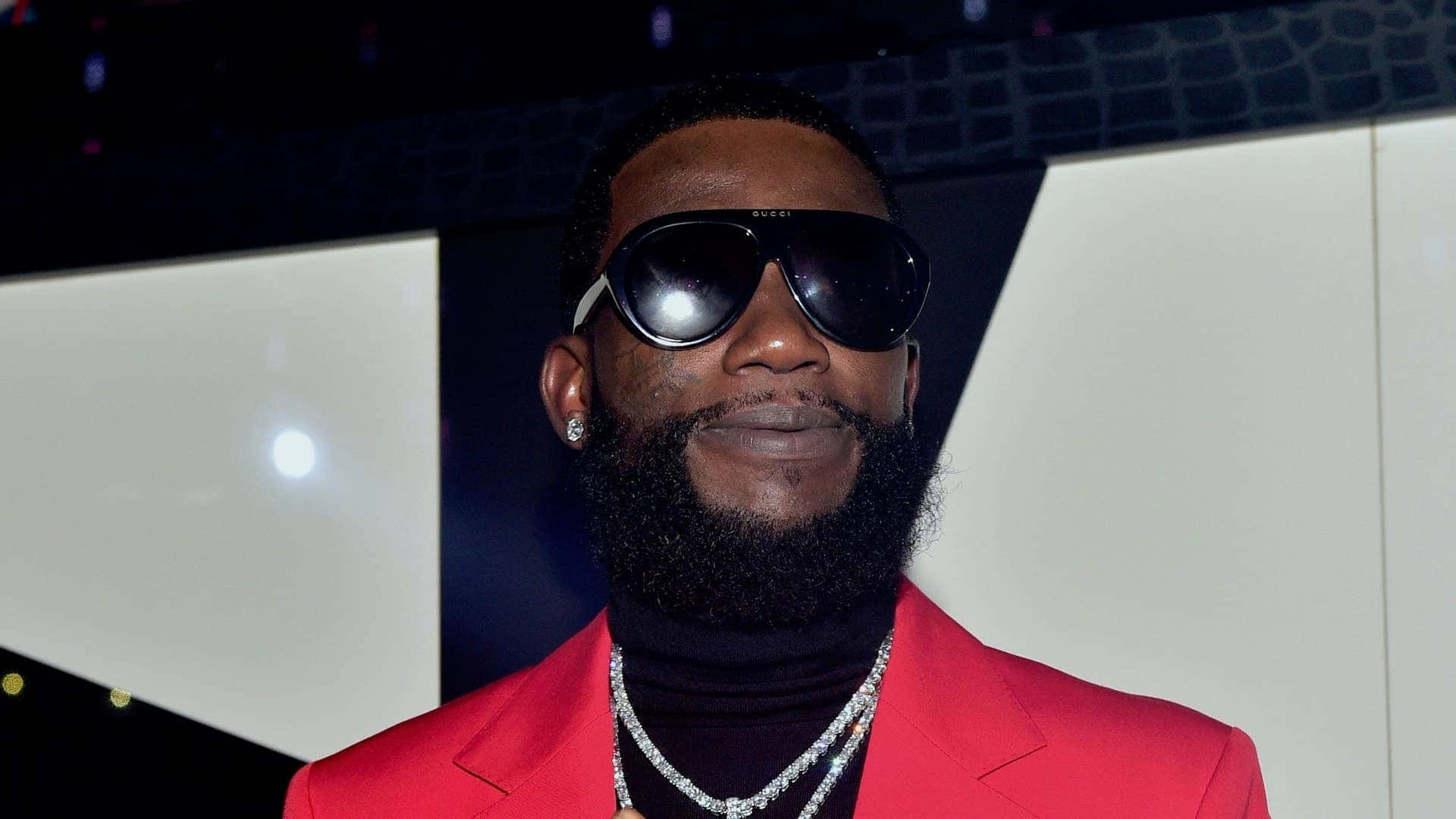 Gucci Mane Red Suit Event Background