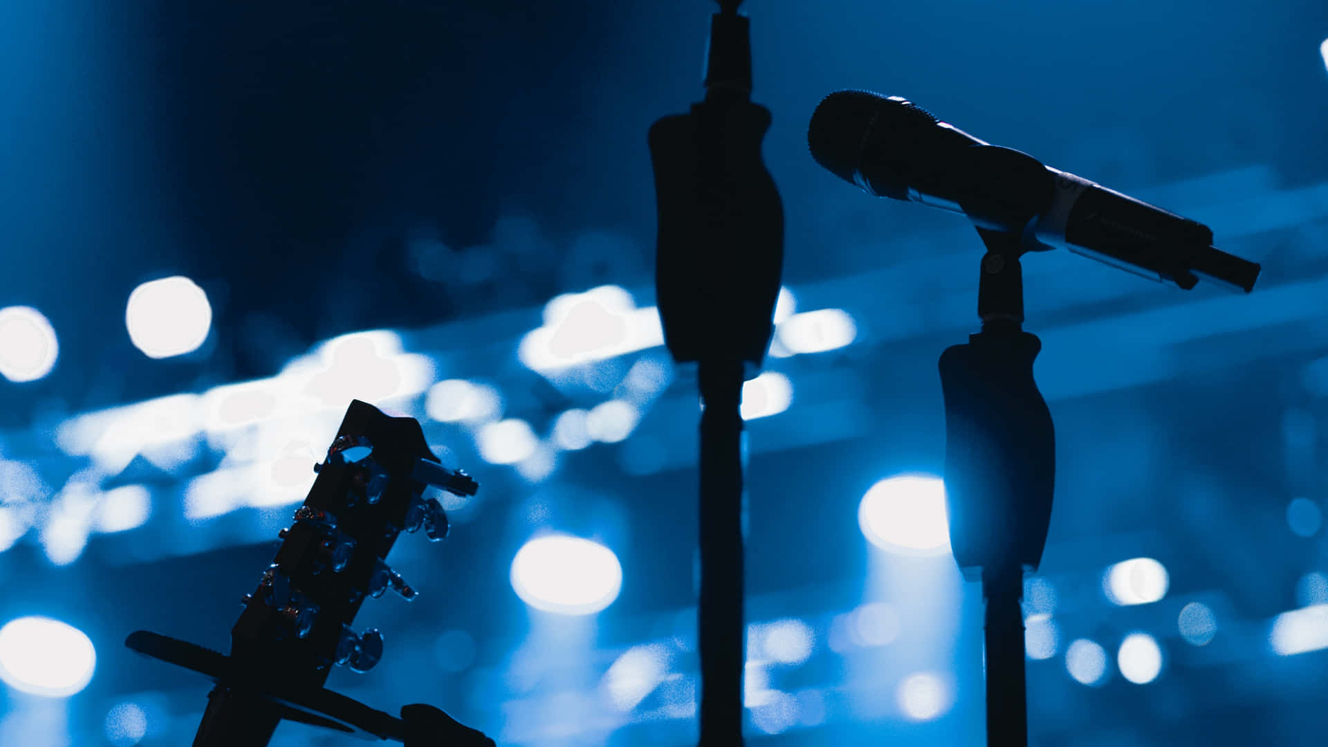 Guitarist's Microphone On The Stage Background