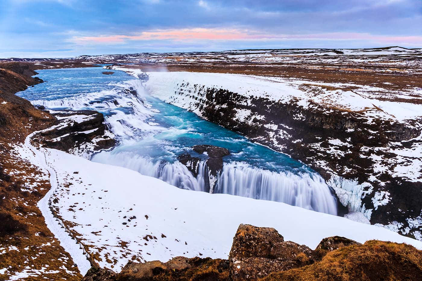 Gullfoss Waterfall With Perennial Snow In Southwest Iceland Background