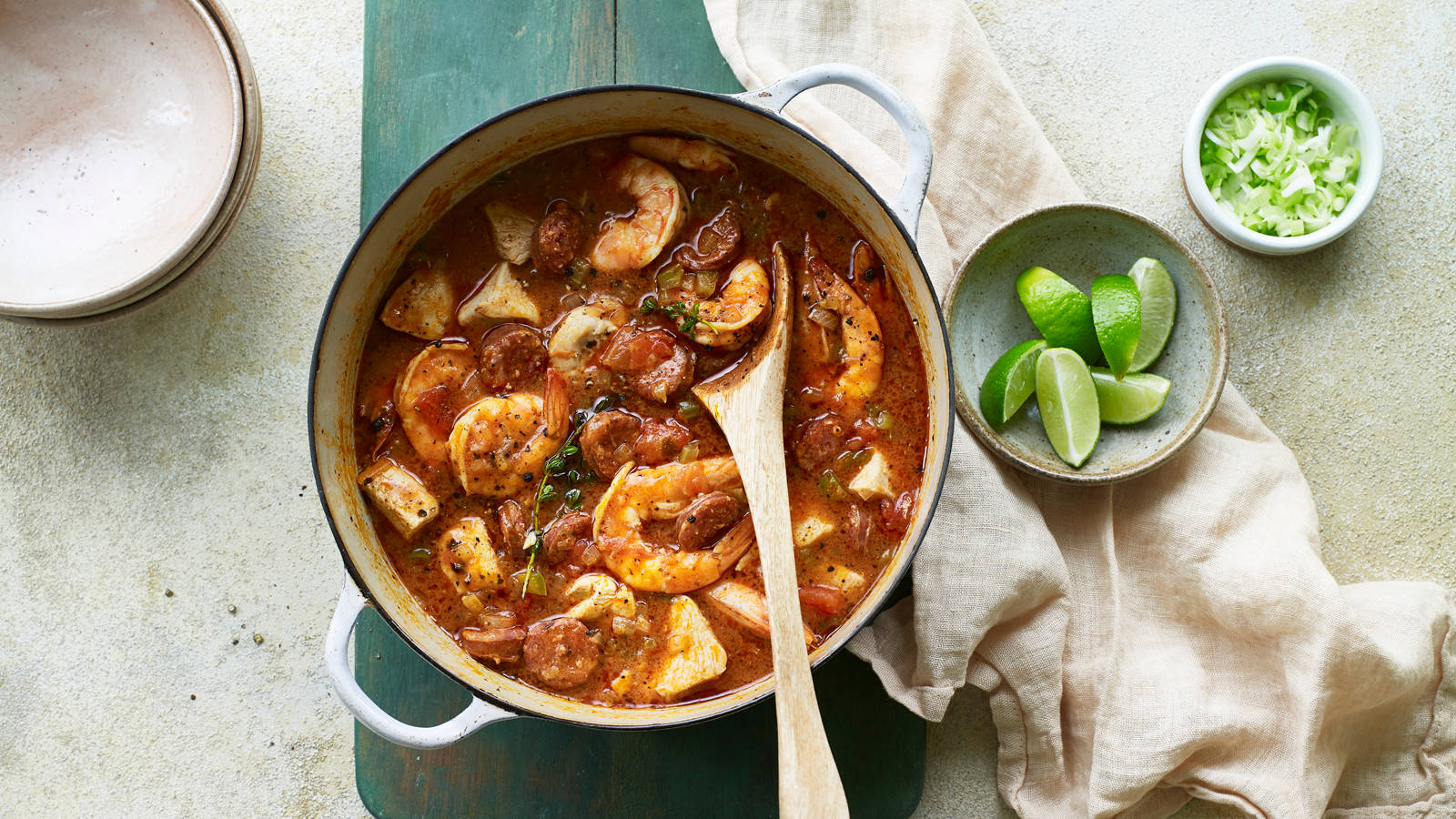 Gumbo In Pot With Lime Slices Background