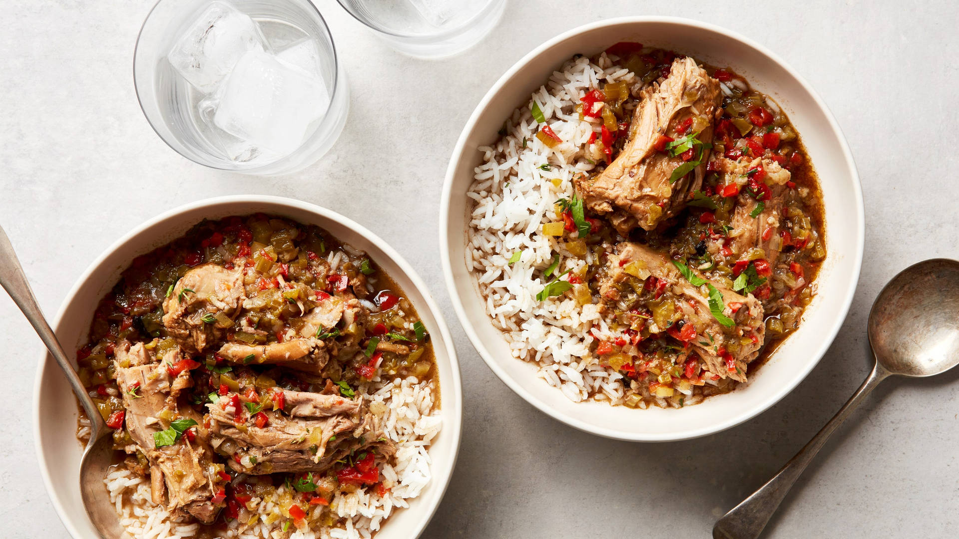 Gumbo Plates With Rice And Water Glasses Background