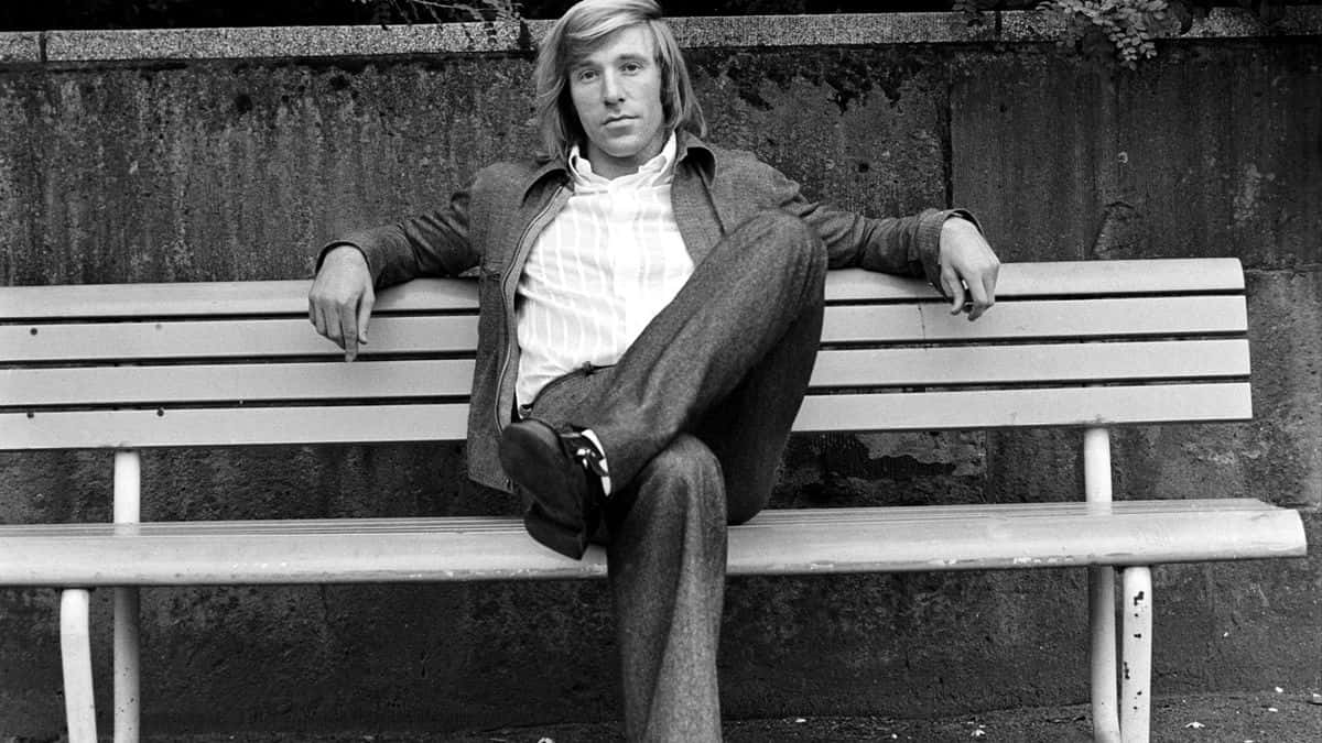 Gunter Netzer Casual Bench Pose Background